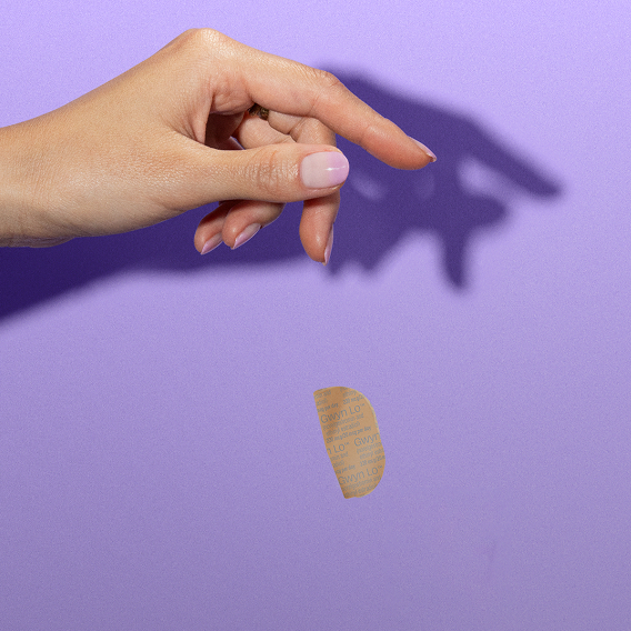 Woman throwing away a birth control patch