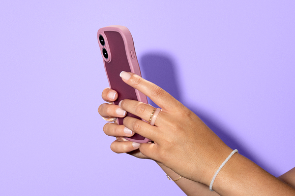 Hands holding a cell phone